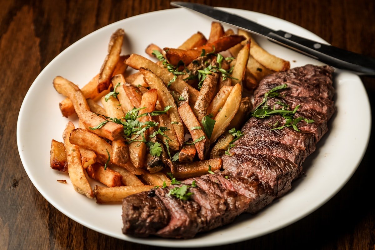 Juicy sliced NY strip steak platter