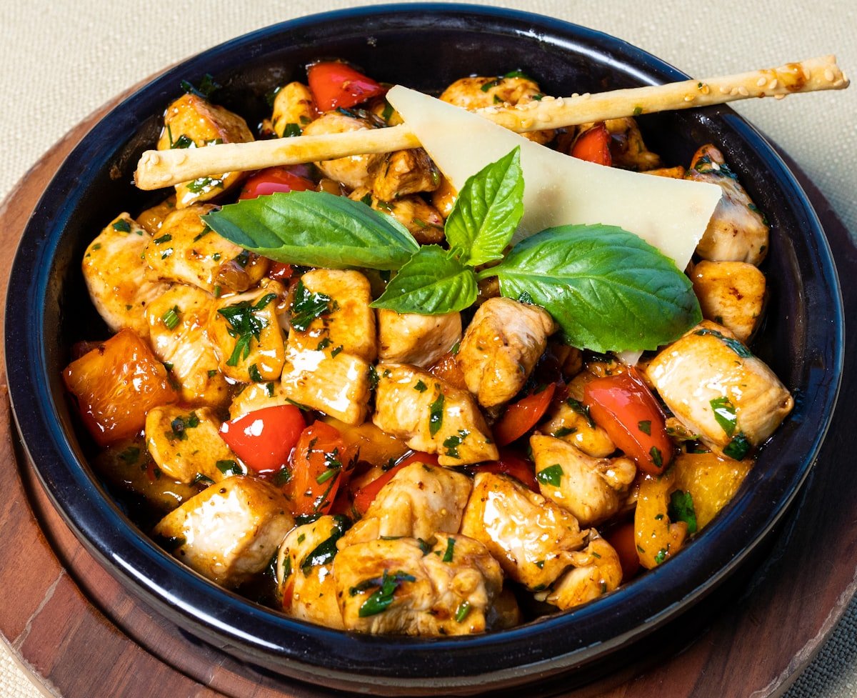 Grilled chicken over spinach and cucumber salad